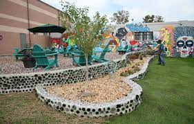 How to build a glass bottle garden wall. Recycled Retaining Wall Made From Glass Bottles Wine Bottle Wall Bottle House Bottle Garden