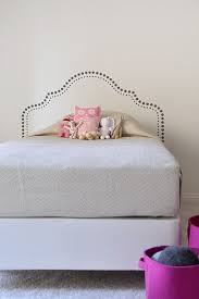 White dahlia painted on the wall for a headboard. The Boo And The Boy Girls Rooms Painted Headboard Headboard Wall Headboard Designs