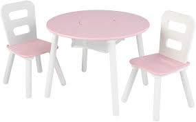 Your little one will love socialising, having a meal or playing games with friends with a picnic table from kidkraft! Amazon Com Kidkraft Wooden Round Table 2 Chair Set With Center Mesh Storage Pink White Gift For Ages 3 8 Toys Games