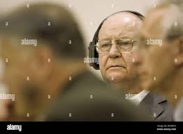 Paul Hashman, center, listens to court proceedings