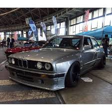 Front bumper extension, side extensions for front bumper, side skirts, front and rear wheel arch extensions, rear wing. Renown Usa Pandem E30 Widebody Aero Kit