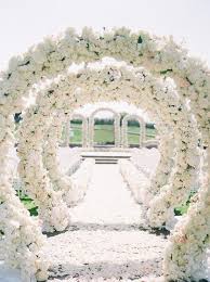 Beach wedding plans should include decorations that fit the overall style and colors of your creative decor by location. This White Wedding Decor Is Straight Out Of A Dream White Wedding Decorations Wedding Entrance Wedding Decorations