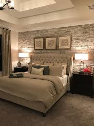 master bedroom with stacked stone accent wall and upholstered bed modern bedroom interior bedroom design inspiration contemporary bedroom decor