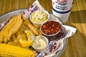 Fried catfish is an american deep south dish, coated in cornmeal and fried in oil or sometimes bacon grease. Deep Fried Catfish Sides Picture Of Michelbob S Championship Ribs Steaks Naples Tripadvisor