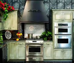 Cabinetry Is Rockefeller Doors And Drawers With London Fog Stain And Brushed Coffee Glaze Granada Range Hood Kitchen Cabinetry Cabinetry Custom Cabinetry