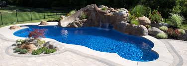 Corner pool with terraced deck. Greece Inground Pool Builder East Rochester Above Ground Pools