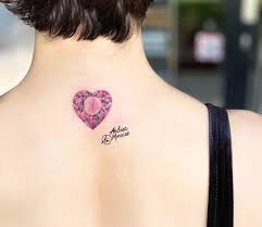 It is not clear what the tattoo says. Diamond Heart Tattoo By Andrea Morales Photo 26815