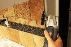 Then, use a mop with a soft head attachment to mop the area down with a degreasing cleaning product and warm water. How To Remove Kitchen Tile Backsplash
