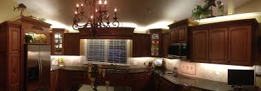 twinkle lights above kitchen cabinets