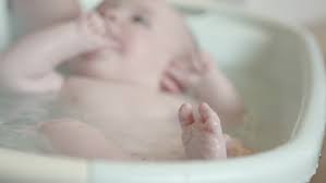 Some parents and caregivers continue to use basin tubs even after baby is sitting up. 4 Months Old Baby Bath Stock Footage Video 100 Royalty Free 6799852 Shutterstock