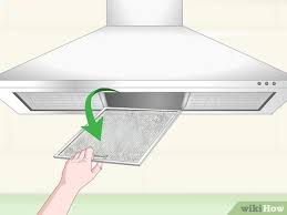 You can wipe while warm, or sprinkle on dry powder, just don't spray cold on hot. 3 Ways To Clean A Range Hood Filter Wikihow