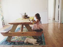 You could always use this tutorial to build an actual picnic table for outdoors i guess. Picnic Table With A Rug In The House Love Love Love Home Fireplace Farmhouse Picnic Table Dinning Room Tables