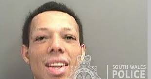 Terrified shop workers pulled down shutters after seeing man pointing gun  in street outside