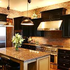 The high ceiling is emphasize with the presence of overhead cabinets and pendant lights. Kitchen Black Cabinets Design Ideas Pictures Remodel And Decor Brick Kitchen Rustic Modern Kitchen Modern Kitchen Island