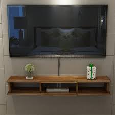 Measure for about a foot of distance between the walls and your rug to give it a grand, sweeping quality. Solid Wood Wall Mounted Set Top Box Rack Small Apartment Living Room Wall Mounted Tv Cabinet Simple Bedroom Wall Cabinet Tv Stands Aliexpress