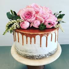 Black And Gold Drip Cake With Flowers Rose Gold Drip Cake Banana Cake Layered With Chocolate Ganache Beautiful Fresh Flowers Supplied By Floralindulgence Cake Created Drip Cakes Cake Banana Cake