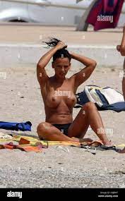 Nereida Gallardo Enjoying her holiday sunbathing topless on the beach and  playing in the surf. Majorca, Spain 22.07.08 Stock Photo - Alamy