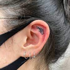 21 Small Ear Tattoos For Minimalists Tiny Ear Tattoo Ideas Allure