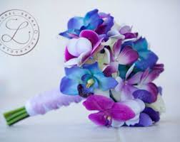 The best blue wedding flowers (and 16 gorgeous blue bouquets). Bridal Bouquet Wedding Flowers Faux Flowers Blue Galaxy Etsy Flower Bouquet Wedding Bridal Bouquet Wedding Flowers Blue Orchids