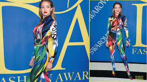 Gigi hadid made sure to deliver by wearing six different outfits on the red carpet and on stage. Gigi Hadid Wears Colorful Versace Catsuit At Cfda Awards Youtube