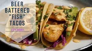 A crunchy coating around tender fish served on tortillas with slaw & a creamy sauce. Beer Battered Vegan Fish Tacos W Garlic Sriracha Sauce Beer Battered Fish Tacos Youtube