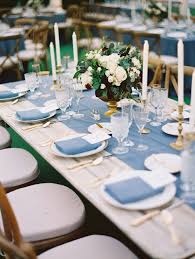 Table Top Decor Dusty Blue Natural Wood Dining Table Brass Candle Stick Holders La Tavola Linens Pastel Blue Wedding Blue Themed Wedding Dusky Blue Wedding