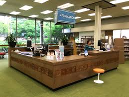 Keeping In Tune With The Mid Century Style Building Of Altadena Public Library Wood Tiles From The Original Circulati Library Shelves Furniture Space Planning