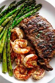 Steak Shrimp Slathered In Garlic Butter Makes For The Best Steak Recipe Cafedelites Com Good Steak Recipes Grilled Steak Recipes Steak And Shrimp
