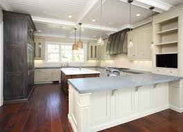 Exquisite kitchen features three goodman hanging lamps illuminating a white center island topped with concrete fitted with a stainless steel sink and gooseneck faucet. Pin By Gina Palmer On Kitchen Home At Last Concrete Countertops Kitchen Countertop Design Concrete Countertops