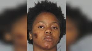Woman accused of beating victim with bat, attacking officer