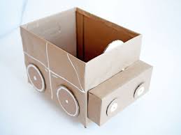 We cut a hole in the bottom of the box in one corner so that you can easily get the marble out if it drops down one of the holes. Quick Easy Recycled Cardboard Storage For Kids Handmade Charlotte