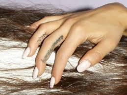 A tattoo grande added to her collection over the past year or so is this quote from one of her favourite films the truman show. A Complete Guide To Ariana Grande S 55 Known Tattoos