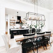 Kitchen With Long Wood Dining Table And Black And White Chairs Modern Farmhouse Dining Room Farmhouse Dining Room Lighting Farm House Living Room