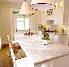 The Peak Of Tres Chic White Kitchens Marble Vs Quartzite Popular Kitchen Countertops Kitchen Countertops Kitchen Remodel