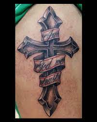 Religious tattoos often have this sort of heavy shading in grayscale. In God We Trust With Cross Tattoo Entertainmentmesh