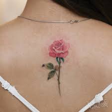 Pink Rose Tattoo On The Upper Back Pink Rose Tattoos Tattoos For Women Small Small Rose Tattoo