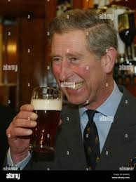 Prince Charles samples a pint of beer ...