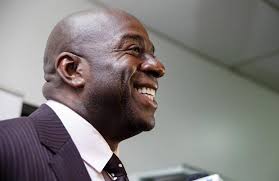 What's Magic Johnson done to help people in Saginaw? A lot, supporters say 