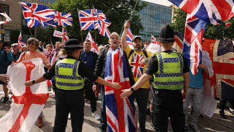 Police clash with protesters as asylum hotel demonstrations take place in UK | UK news | The Guardian