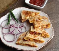 Chicken quesadillas are a great way to use leftover cooked chicken breast, and this recipe is so fast, you can have dinner on the table in 15 minutes! Chicken Quesadilla Indian Style
