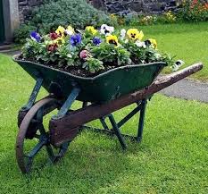 Rustic Wheel Barrow Container Gardening In 2020 Wheelbarrow Wheelbarrow Planter Wheelbarrow Garden