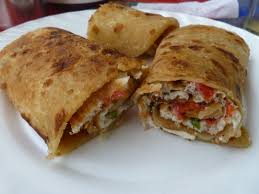 Ugandan Street Food Called A Rolex It S A Omelette Wrapped In Chapatti Or Tortilla With Tomatoes Eggs And Lettuce Ugandan Food Food African Cooking