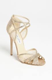 Dressing for a special occasion or event calls for elegant designer sandals. Jimmy Choo Sparkle Gold Heels Jimmy Choo Wedding Shoes Wedding Shoes Jimmy Choo Shoes