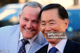 Actor George Takei arrives with spouse Brad Altman for the world... News  Photo