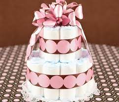 Nessa proposta as fraldas são enroladas formando rolinhos. Como Fazer Um Bolo De Fraldas Para O Cha De Bebe La Vem Bebe