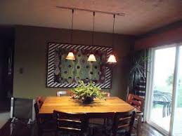 Perfect for the kitchen or dining room, track lighting fixtures offer plenty of light and style without taking up too much space. The Dining Room Today See Blog To Follow This Room Through The Years Pendant Lighting Dining Room Dining Room Lighting Lights Over Dining Table