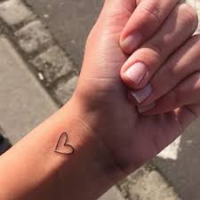 Heart and cross bracelet tattoos on wrist ideas for religious girls. 51 Cute Heart Tattoo Designs You Will Love 2021 Guide