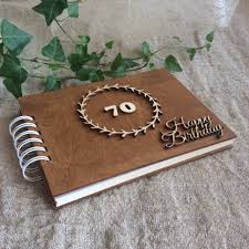 At that age, they probably have most of what they need. 70th Birthday Gift Wooden Photo Album Scrapbook For Grandma Etsy In 2021 70th Birthday Gifts Birthday Scrapbook 70th Birthday