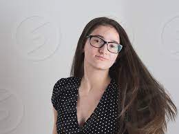 Longhaired honey is inserting banana in her muff. Portrait Of A Smiling Bespectacled Long Haired Brunette Teen Girl By Ferenc Kosa Photo Stock Snapwire