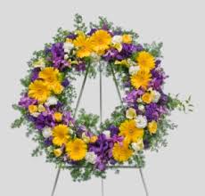Our skilled florists may substitute flowers for. Purple Yellow And White Wreath For Funeral Services Only
